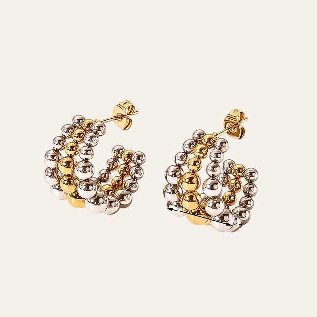 Aretes Fame en mezcla de oro y plata