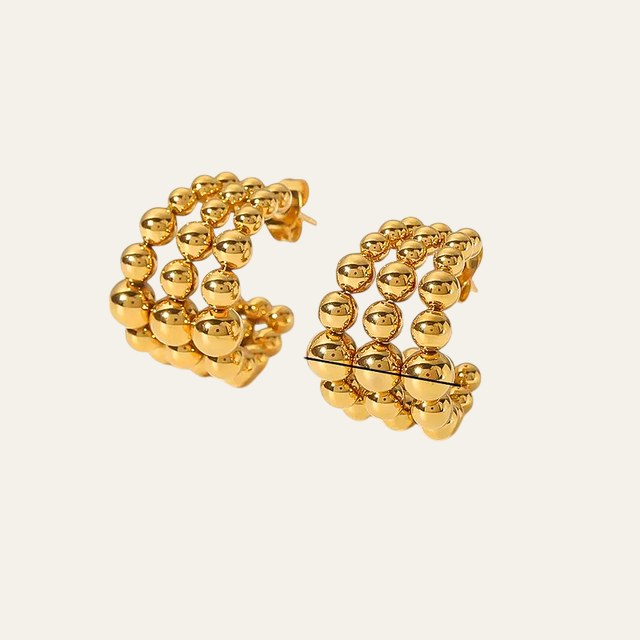 Aretes Fame dorados de triple aro de esferas